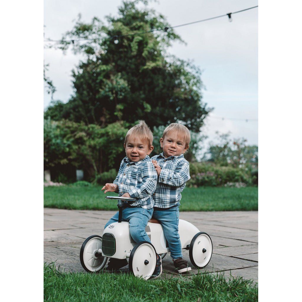 twin boys riding Vilac Classic Ride-On Racing Car - 18m+ - Off White