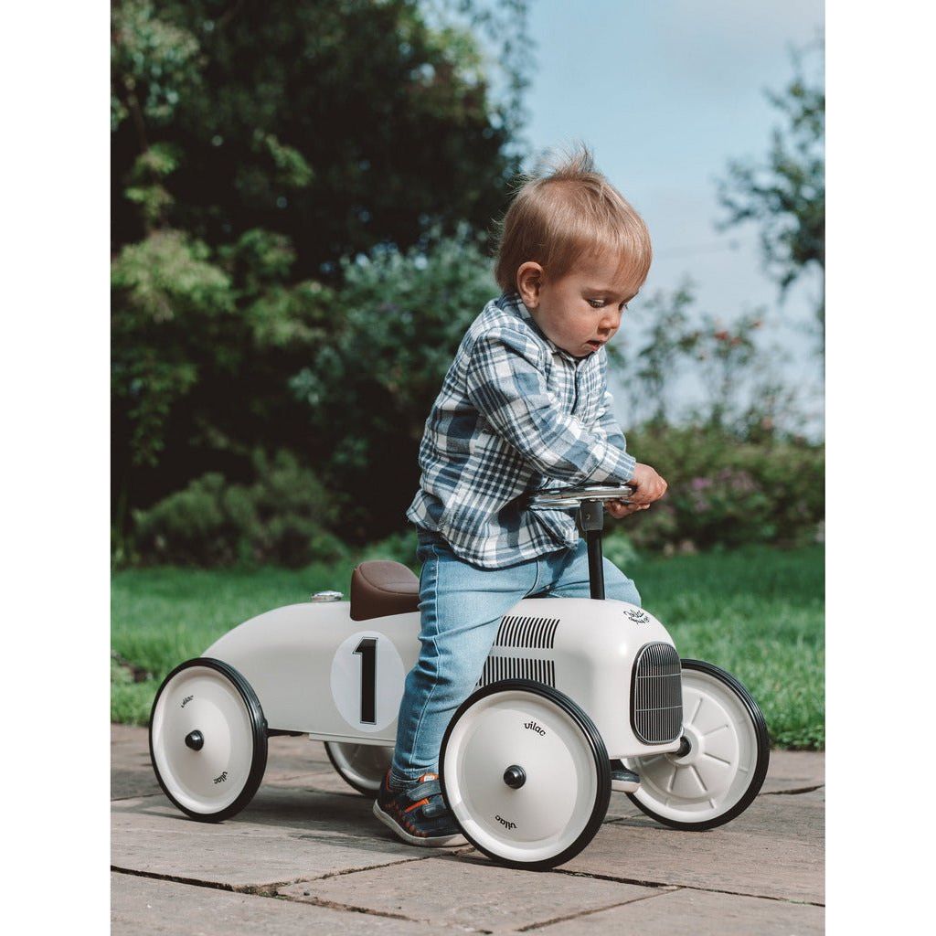 little boy steering Vilac Classic Ride-On Racing Car - 18m+ - Off White