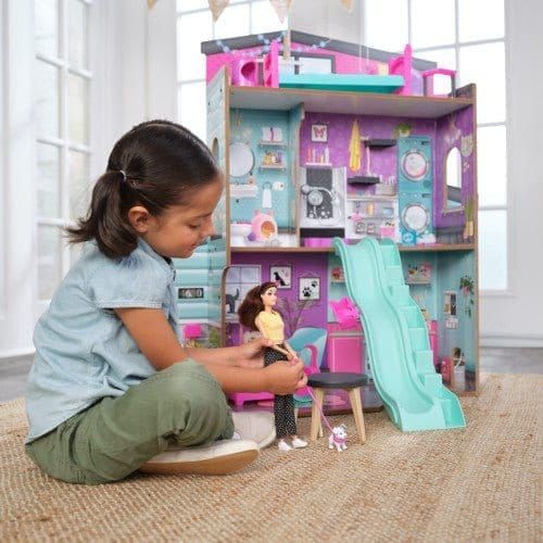 girl with doll playing with Kidkraft Purrfect Pet Dollhouse