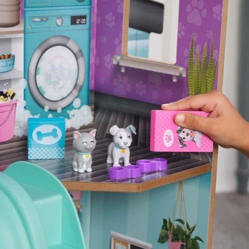 close up of child feeding cat and dog toys from Kidkraft Purrfect Pet Dollhouse