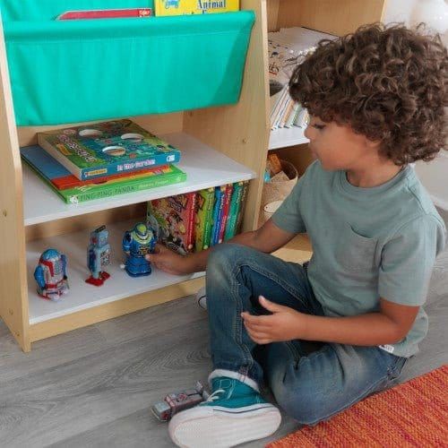boy sitting playing with figurines from KidKraft Pocket Storage Bookshelf - Natural
