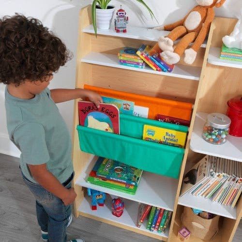 boy taking book from KidKraft Pocket Storage Bookshelf - Natural