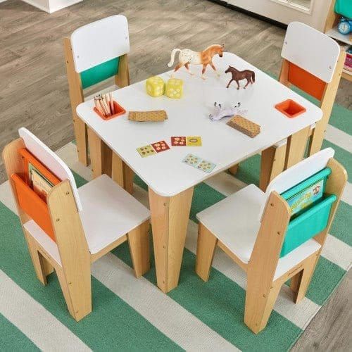 KidKraft Pocket Storage Table and 4 Chair Set - Natural on striped rug with toys on top