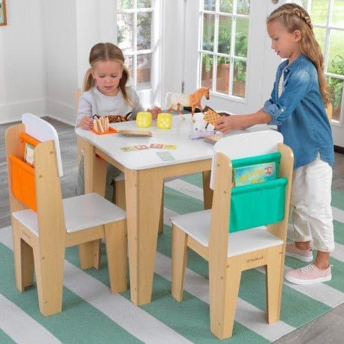 2 girls doing crafts at KidKraft Pocket Storage Table and 4 Chair Set - Natural