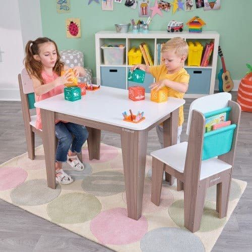 girl and boy playing at KidKraft Pocket Storage Table & 2 Chair Set - Gray Ash