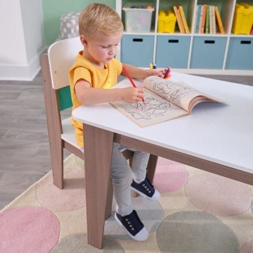 boy colouring in while sitting at KidKraft Pocket Storage Table & 2 Chair Set - Gray Ash