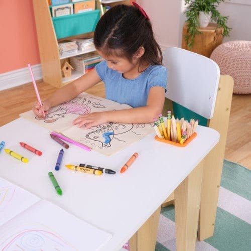 girl colouring in whillst sitting at KidKraft Pocket Storage Table & 2 Chair Set - Natural
