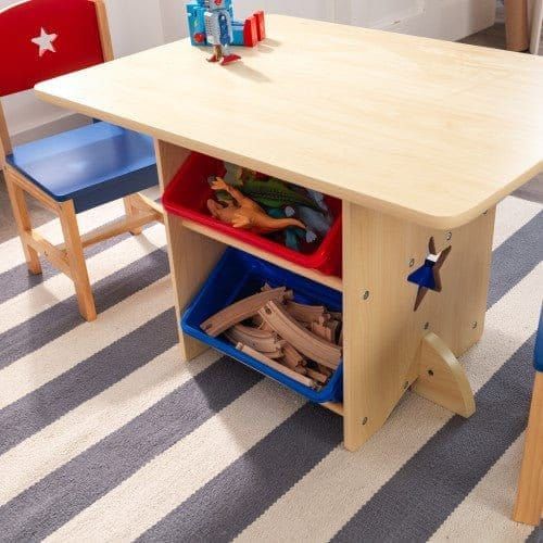 KidKraft Star Table & Chair Set with toys on storage boxes