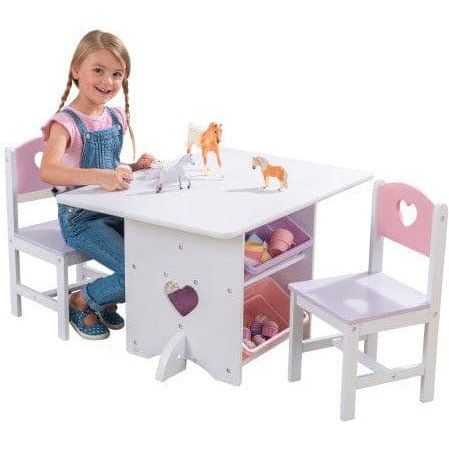 girl sitting at KidKraft Heart Table & Chair Set