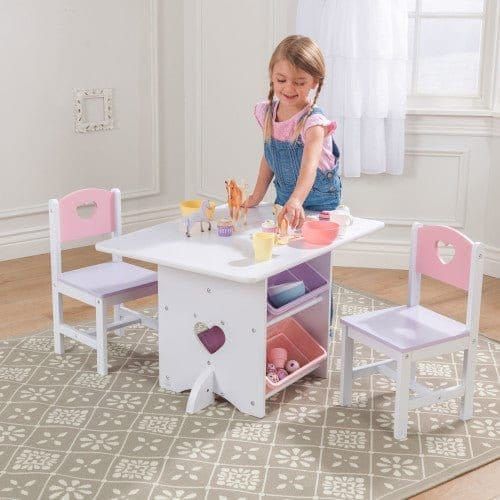girl laying table of KidKraft Heart Table & Chair Set