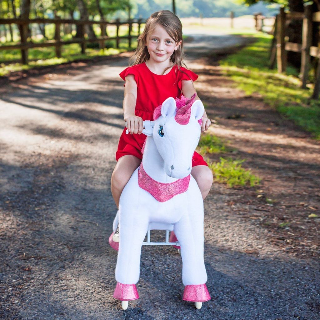 girl riding Ponycycle Model E Ride-on Unicorn Toy Age 4-8