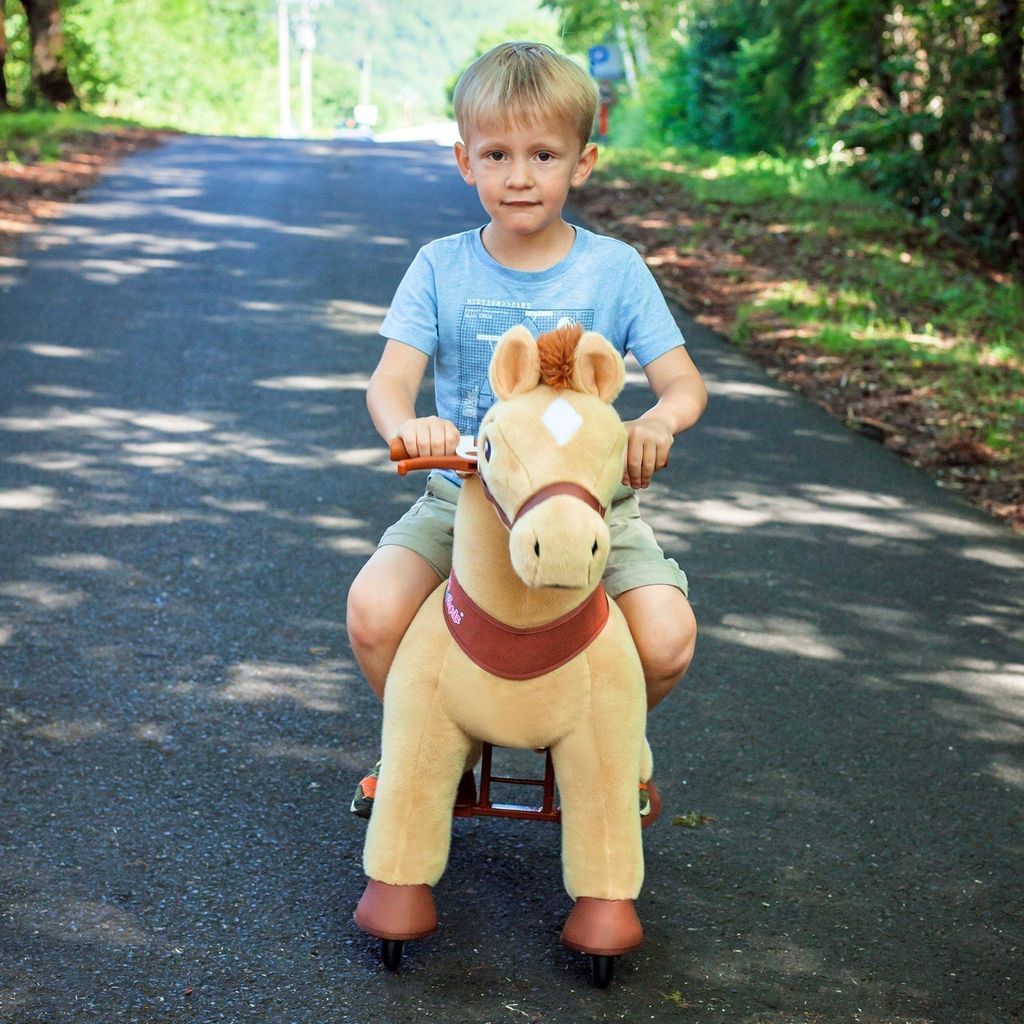 boy riding Ponycycle Model E Ride-on Horse Toy Age 4-8
