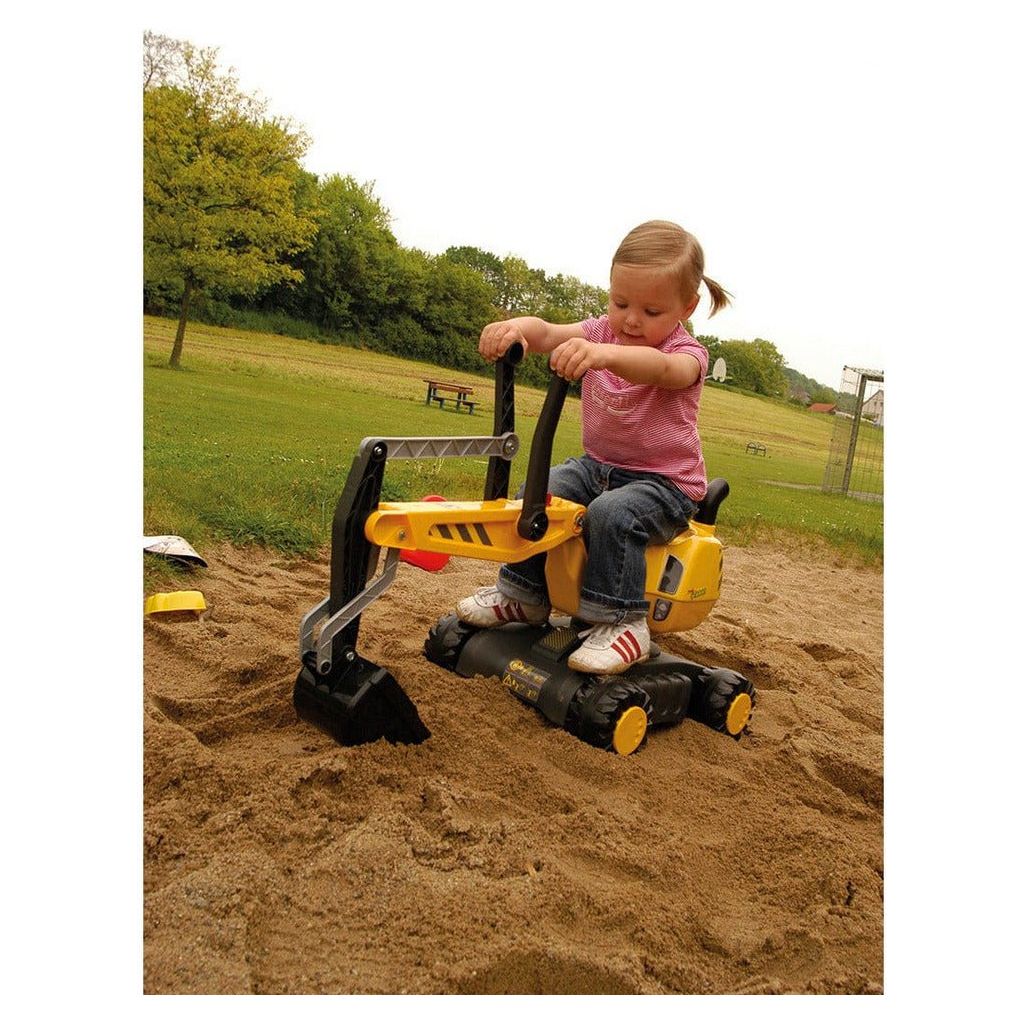 girl using scoop on Rolly Toys Mobile 360 Degree Excavator - Yellow