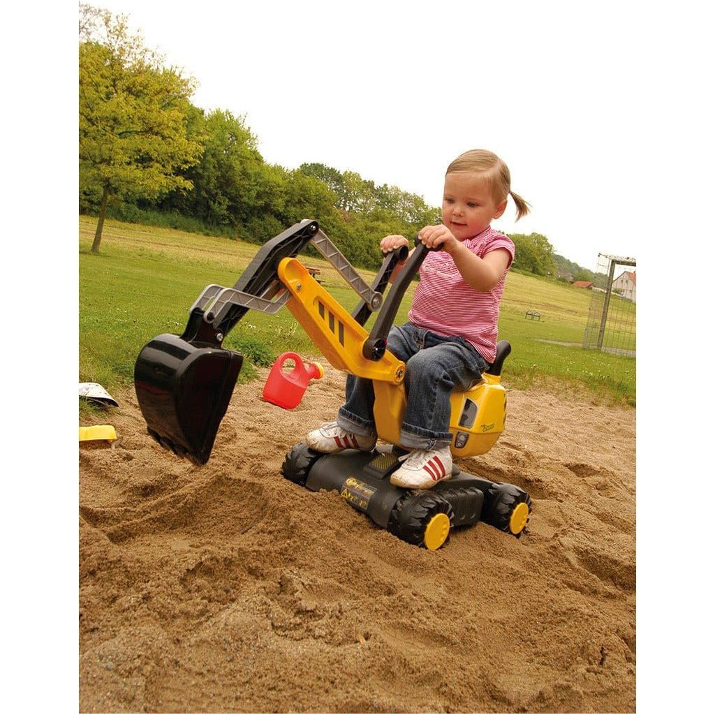 girl using Rolly Toys Mobile 360 Degree Excavator - Yellow in sandpit