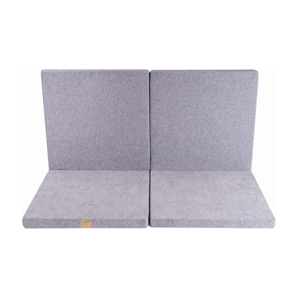 Meow Baby Square Foldable Baby Play Mat in steel folded againt wall