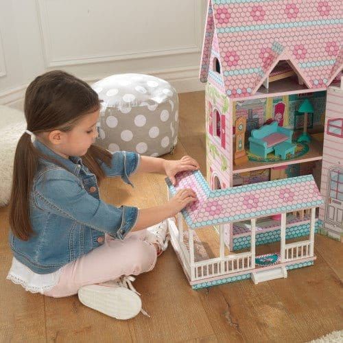 girl playing with porch on KidKraft Abbey Manor Dollhouse