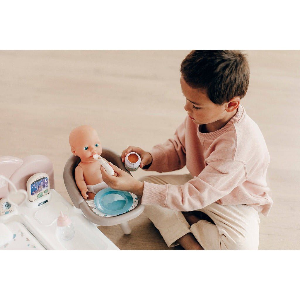 boy feeding doll with Smoby Baby Nurse 3 in 1 Electronic Nursery