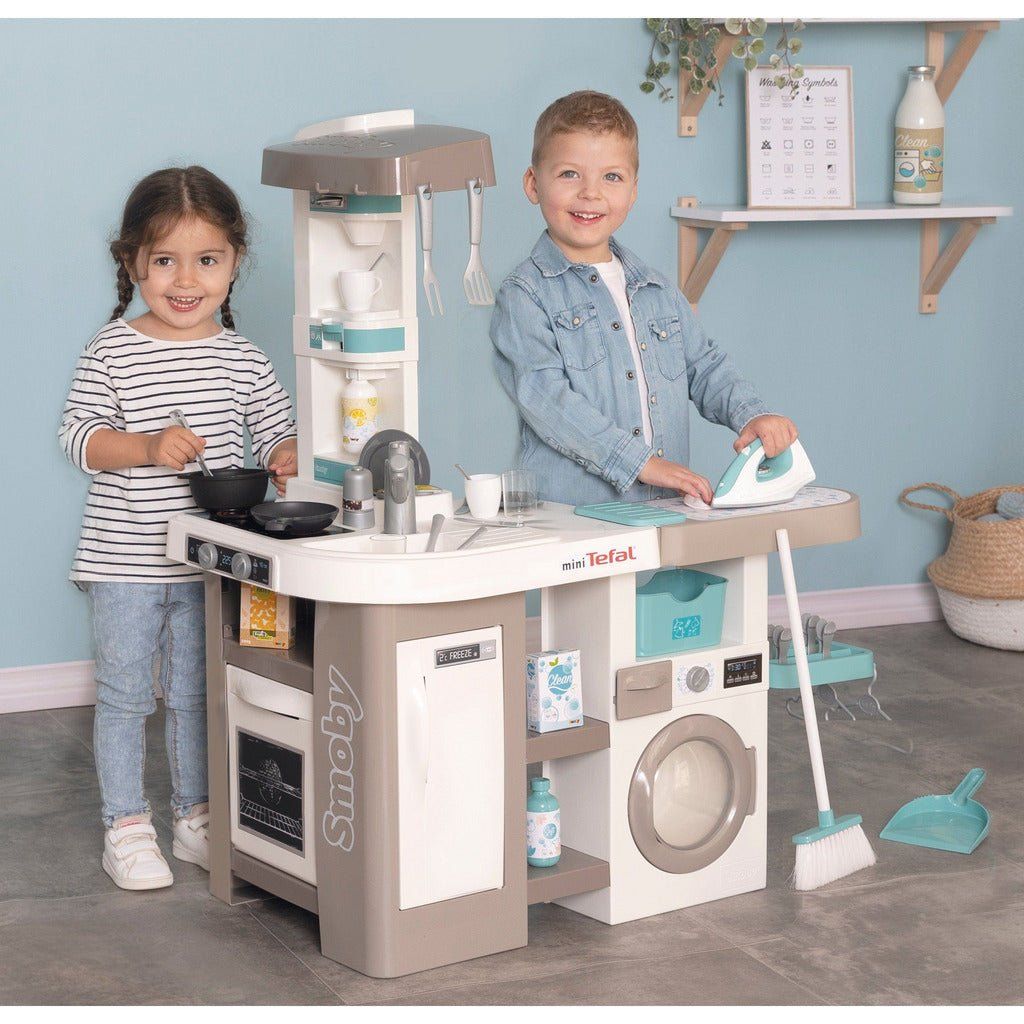 children playing with Smoby Tefal Studio Utility Kitchen