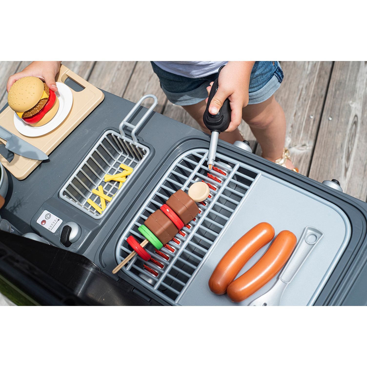 kebab and sausges grilling on Smoby Garden Kitchen BBQ Set 