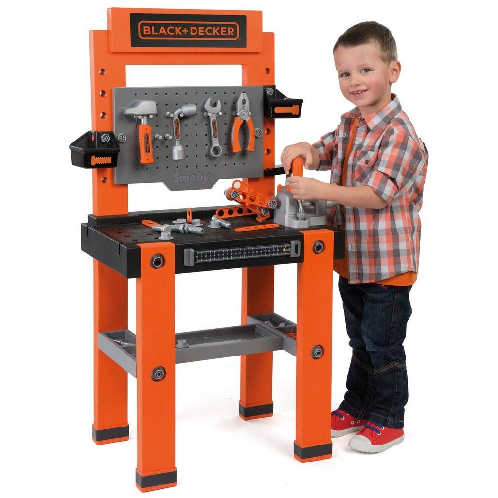 boy playing with Smoby Black & Decker Bricolo One Workbench