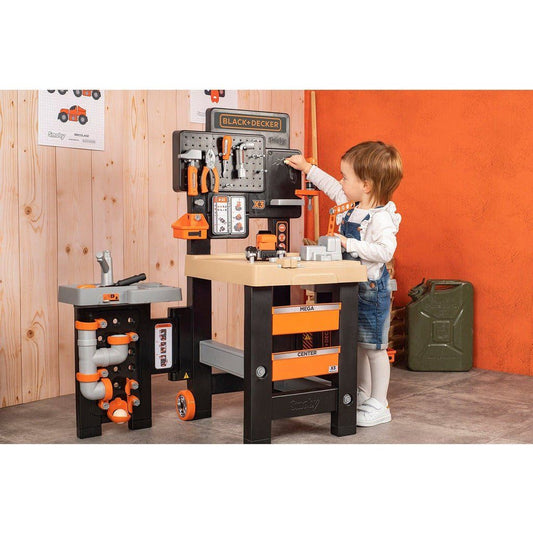 girl playing with Smoby Black & Decker Mega Centre