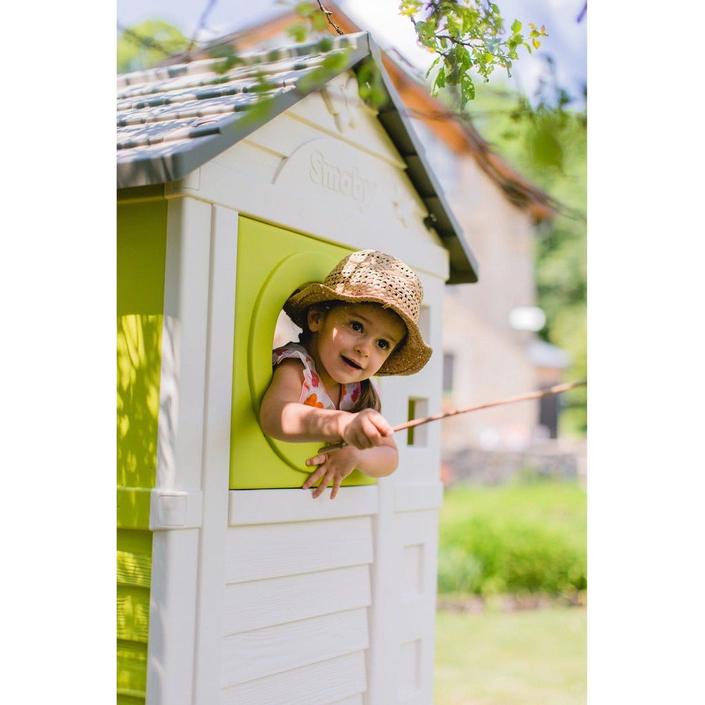 child leaning out of window on Smoby House On Stilts Playhouse