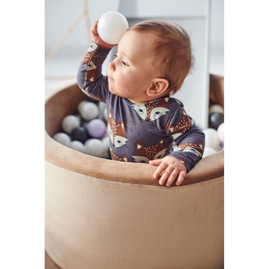 baby boy holding ball in Misioo Velvet Ball Pit Gold with 200 Balls