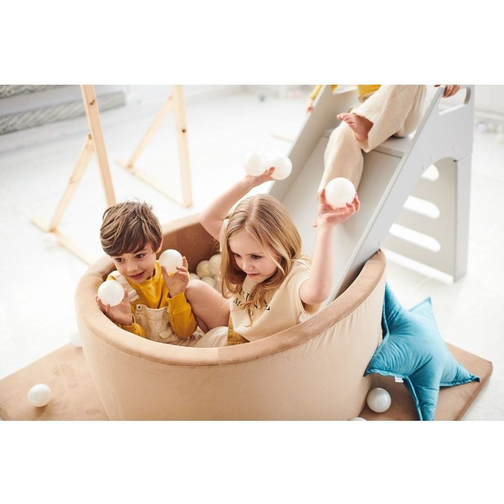 boy and girl sitting in Misioo Velvet Ball Pit Gold with 200 Balls