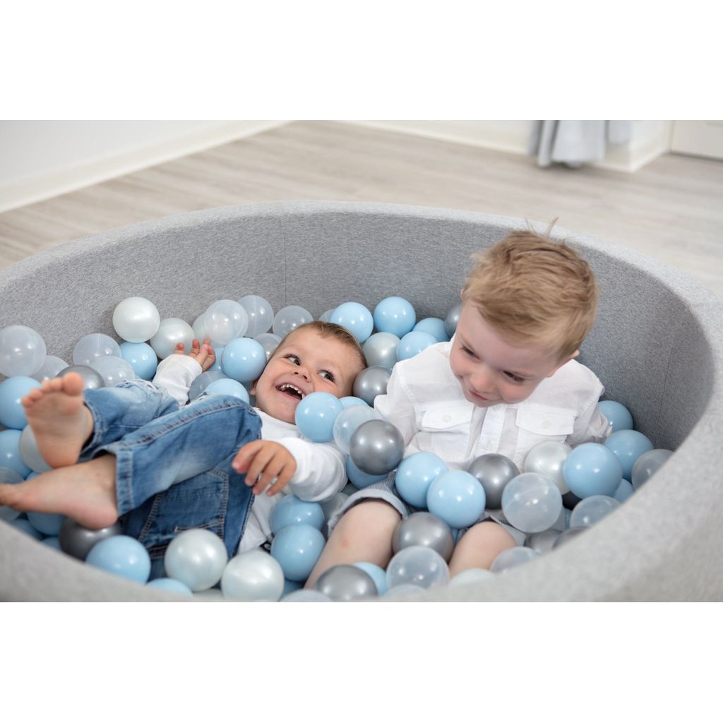 2 boys lying in Misioo Joy Cotton Ball Pit Grey with 200 Grey and Blue Balls