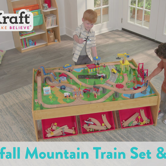 boys playing with KidKraft Waterfall Mountain Train Set & Table