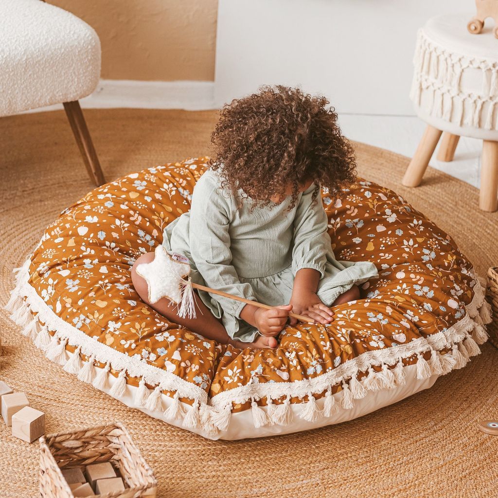 girl with head bowed on MINICAMP Kids Floor Cushion Seating Pouffe in Plant Pattern