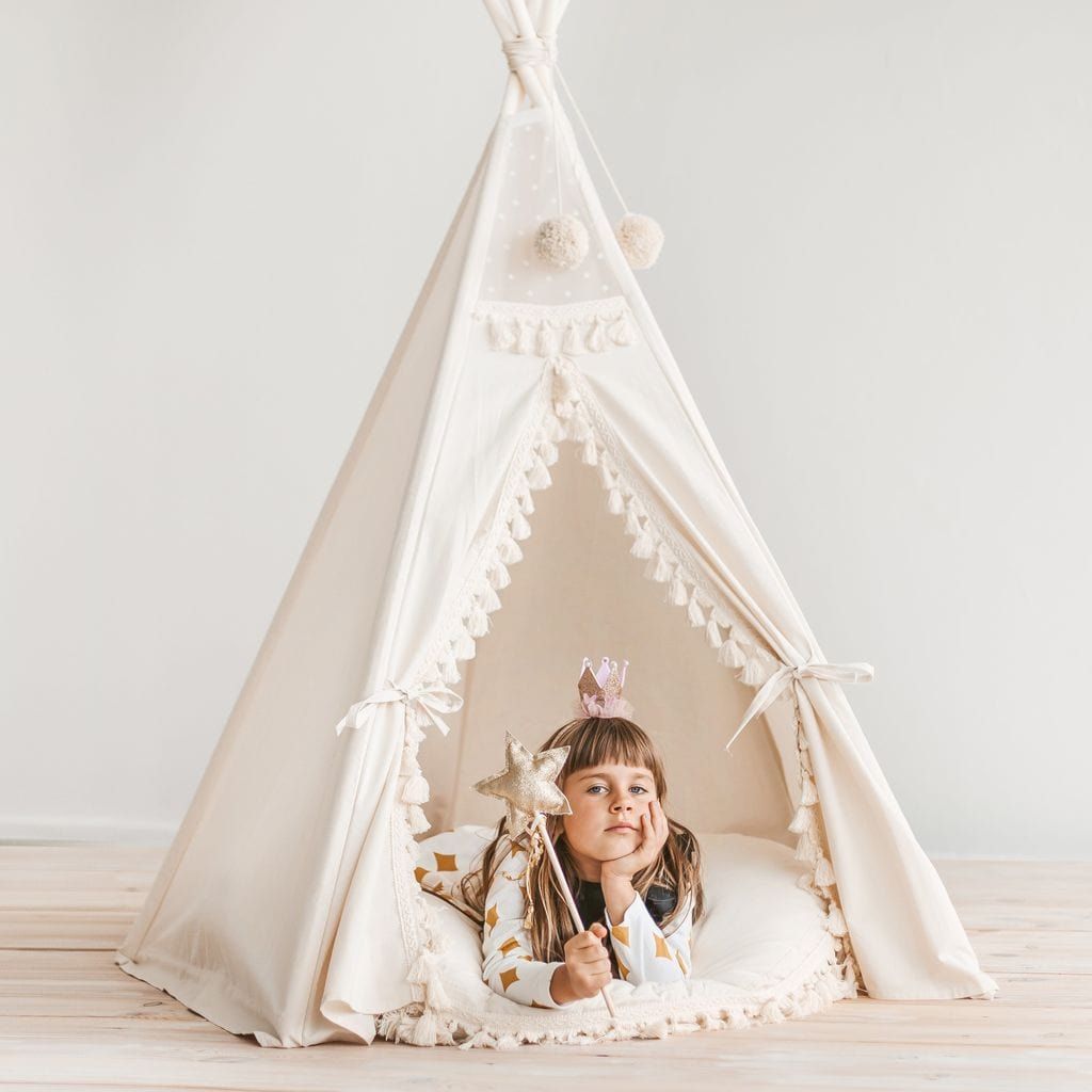 girl with wand lying in MINICAMP Boho Kids Teepee With Tassels