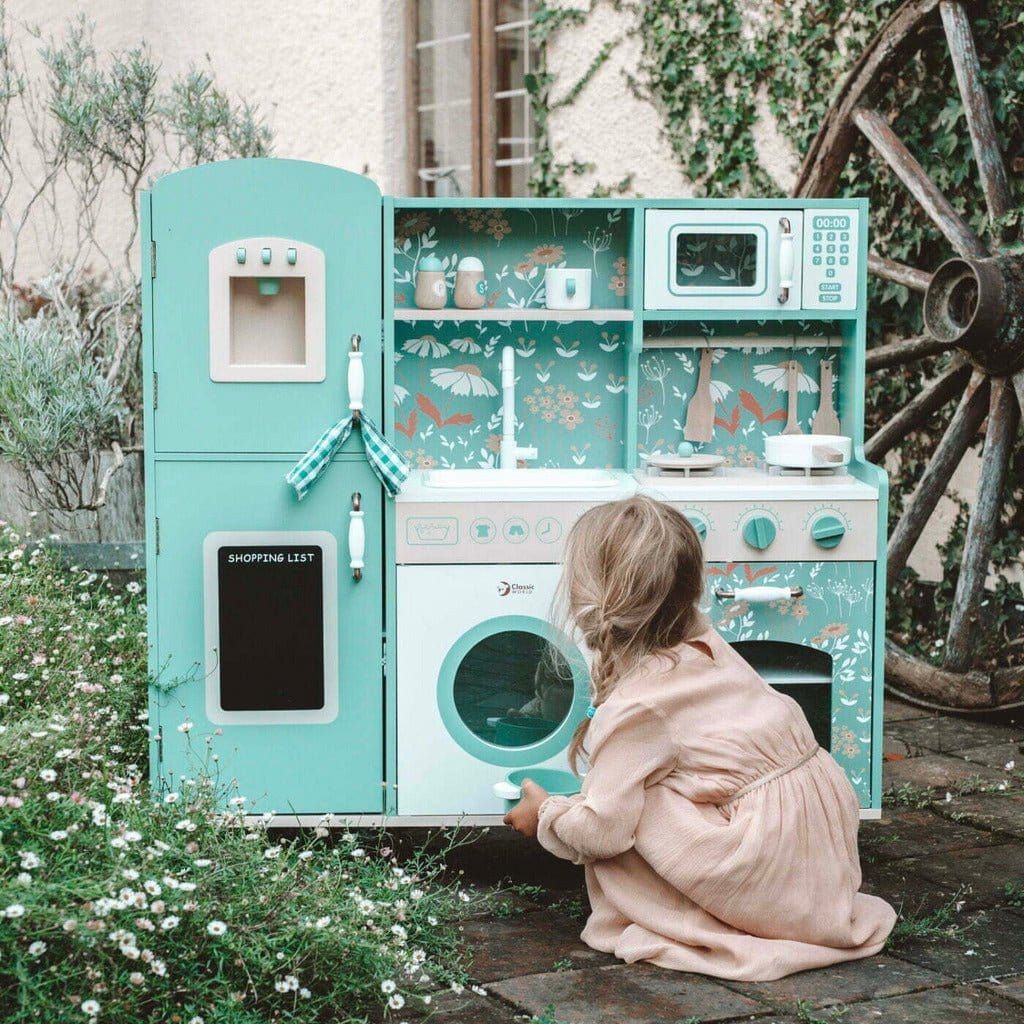 little girl playing with Classic World Wooden Vintage Kitchen