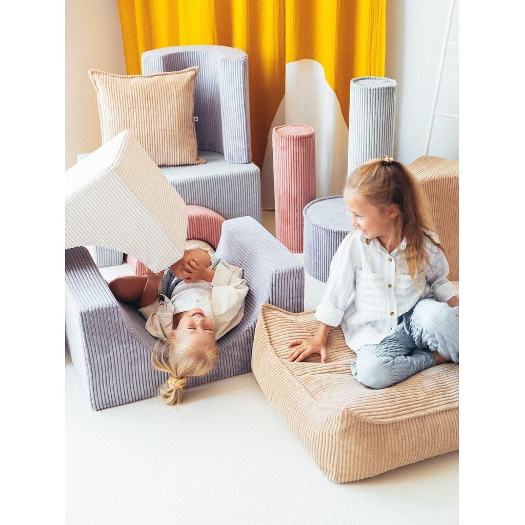 girls sitting on beanbag chairs talking