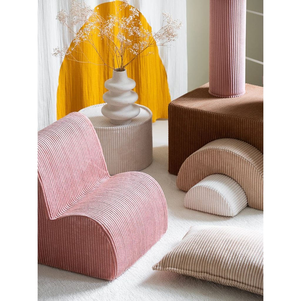 Wigiwama Pink Mousse Kids Cloud Chair close up next to softplay set