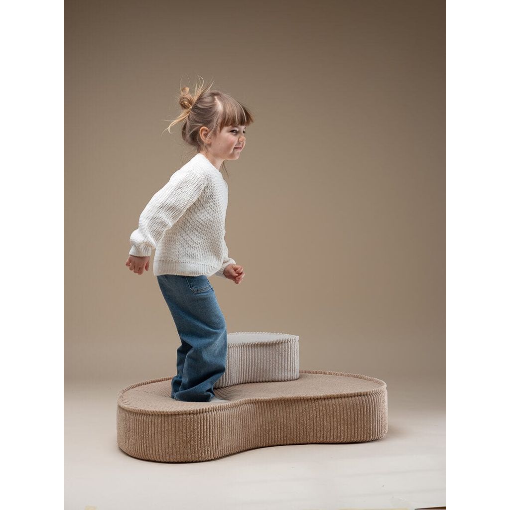 girl standing on Wigiwama Brown Sugar Lounge Chair