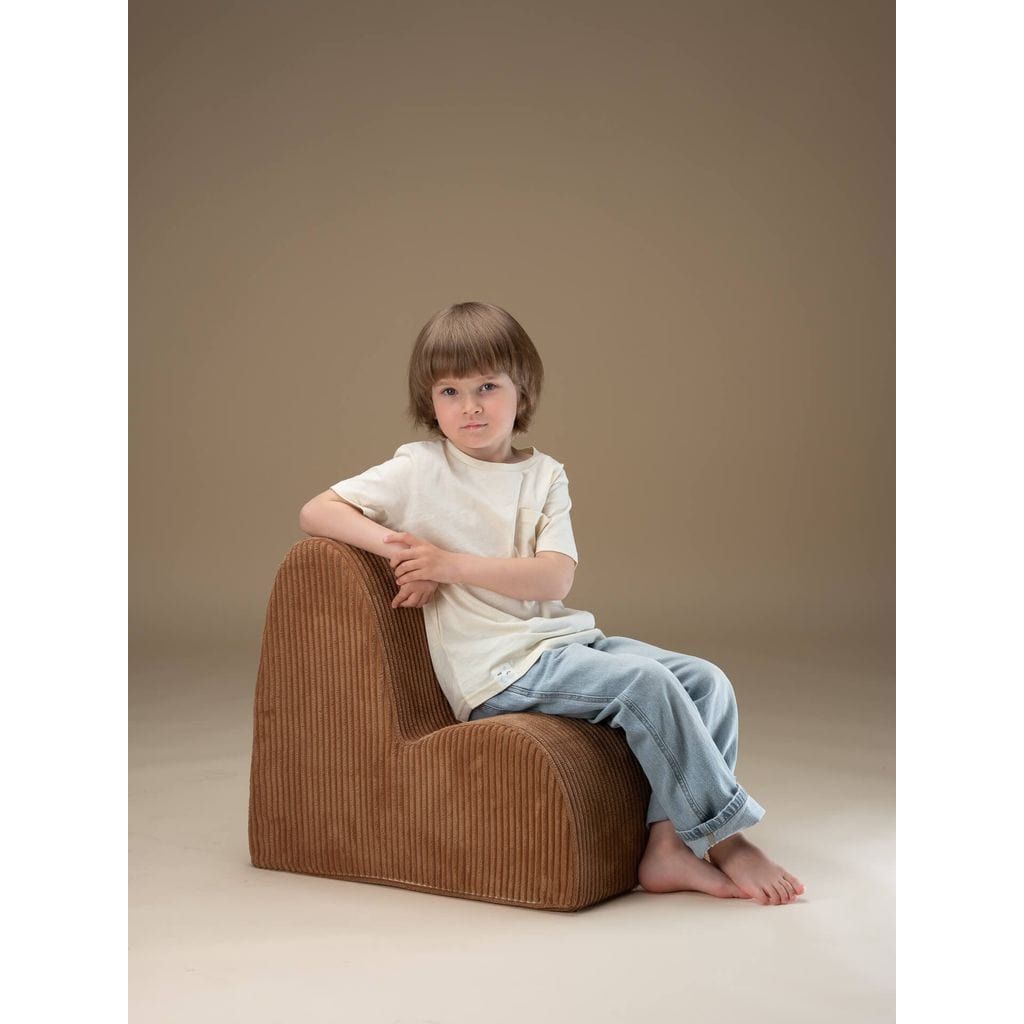 boy sitting on Wigiwama Toffee Cloud Chair kids furniture