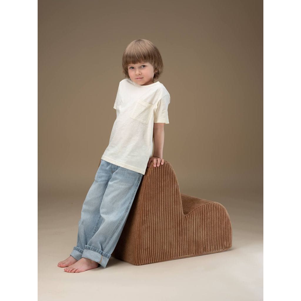 boy standing and leaning against Wigiwama Toffee Cloud Chair
