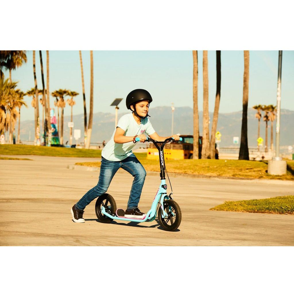 boy pushing off on Razor Flashback Scooter - Blue