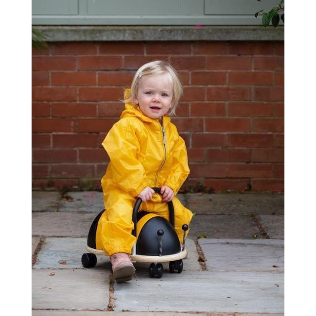 girl in yellow riding Wheelybug Ride On - Bee