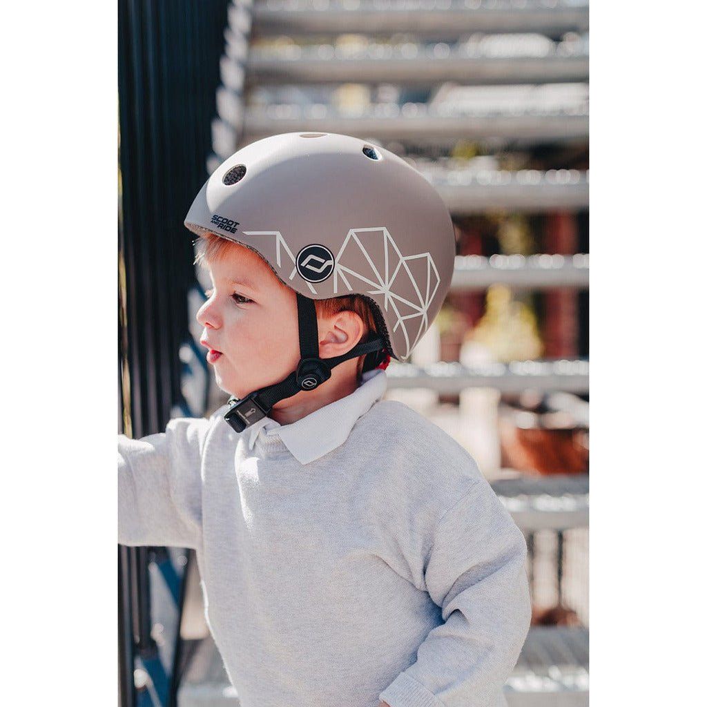 little boy on stairs wearing Scoot and Ride Helmet XXS - S - Brown Lines