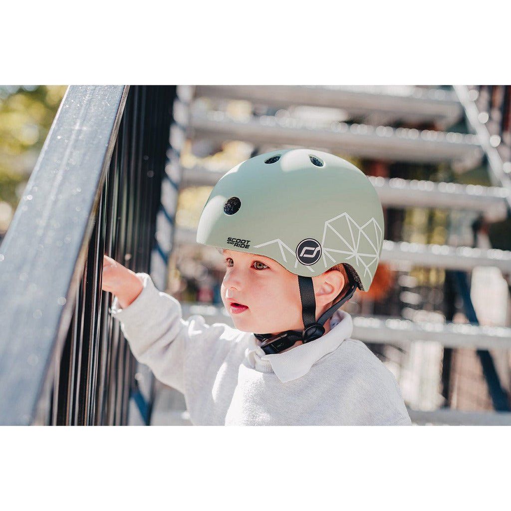 little boy on stairs wearing Scoot and Ride Helmet - XXS - S - Green Lines