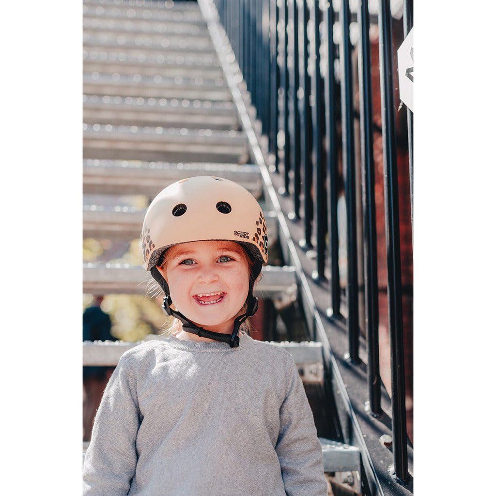 little girl wearing Scoot and Ride Helmet - XXS - S - Leopard