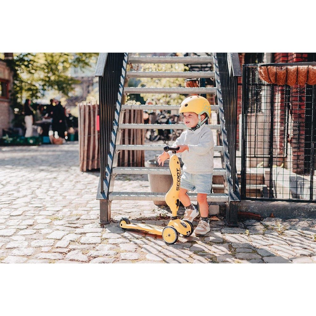 little boy by stairs with Scoot and Ride Highwaykick 1 scooter - Lemon - Age 1-5 Years