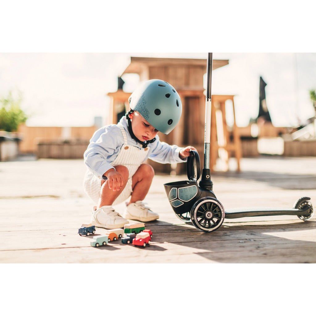 child with toy cars crouching next to Scoot and Ride Highwaykick 2 Lifestyle - Age 2+ - Reflect Steel