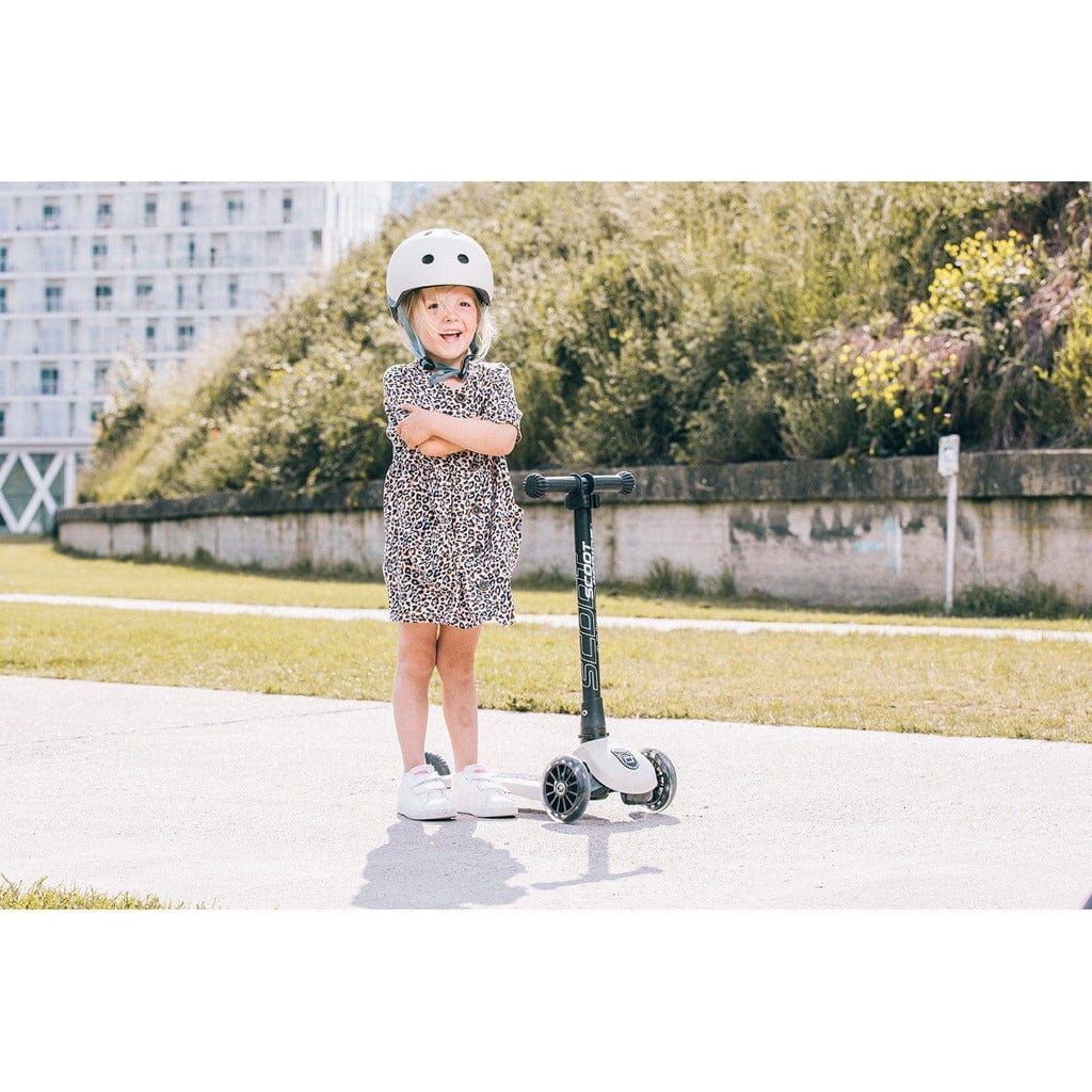 little girl with arms folded standing next to Scoot and Ride Highwaykick 3 - Age 3+ - Led Ash