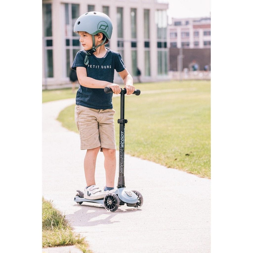 boy riding Scoot and Ride Highwaykick 3 Scooter - Age 3+ - Led Steel