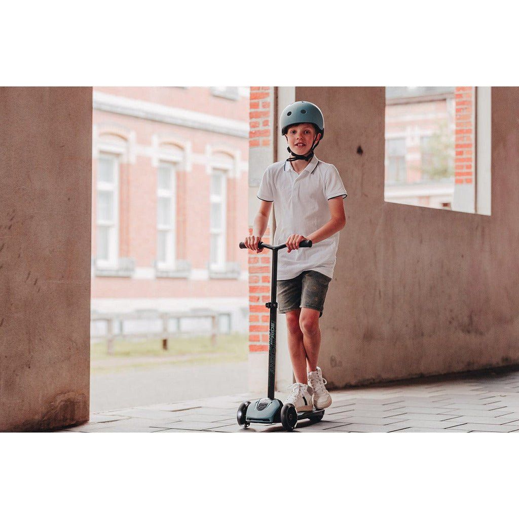 boy standing on Scoot and Ride Highwaykick 5 Scooter - Led Steel