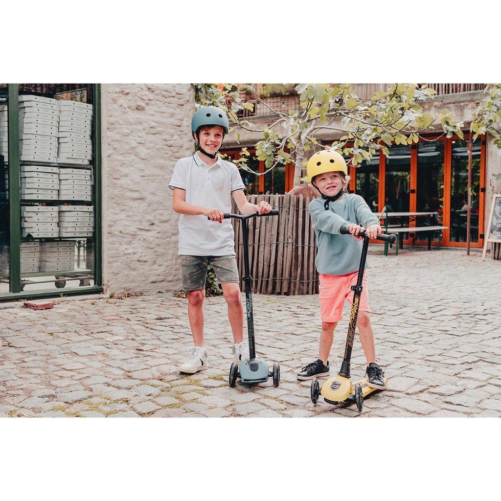 boys in streets with Scoot and Ride Highwaykick 3 Scooter - Age 3+ - Led Steel and Yellow