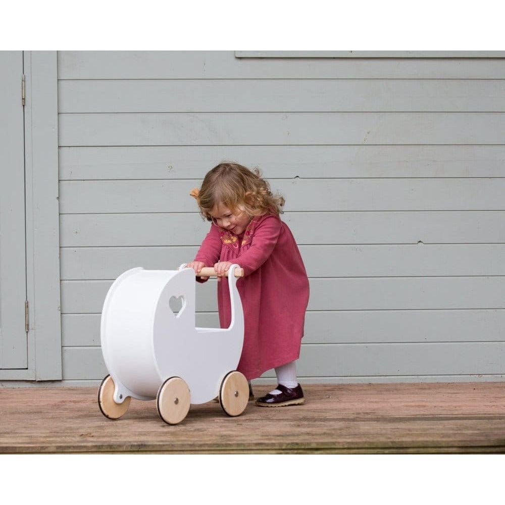 little girl pushing Moover Wooden Dolls Pram - 2 Years+ - White